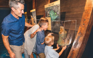 Family at the Shipwrecked Treasure Museum, one of the top Branson museums for families