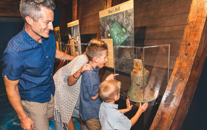 Family at the Shipwrecked Treasure Museum, one of the top Branson museums for families
