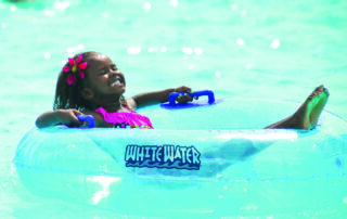 Young girl floating on tube at Branson water park